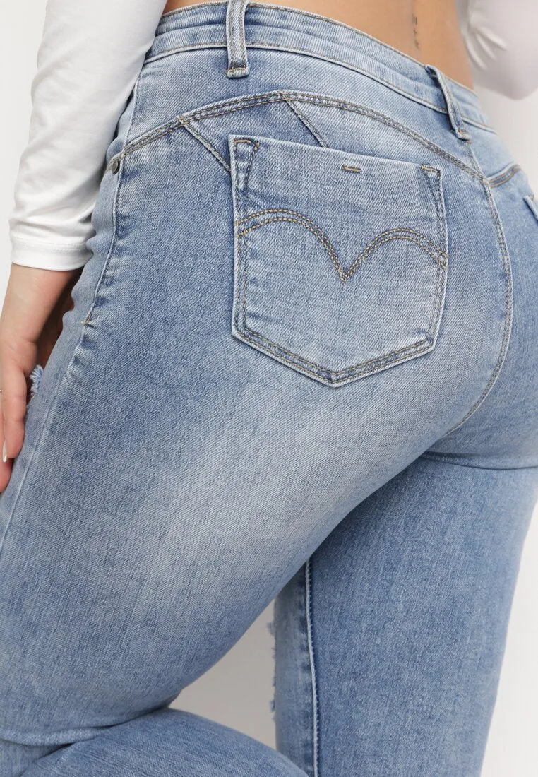 Jean skinny bleu avec trous et effet push up
