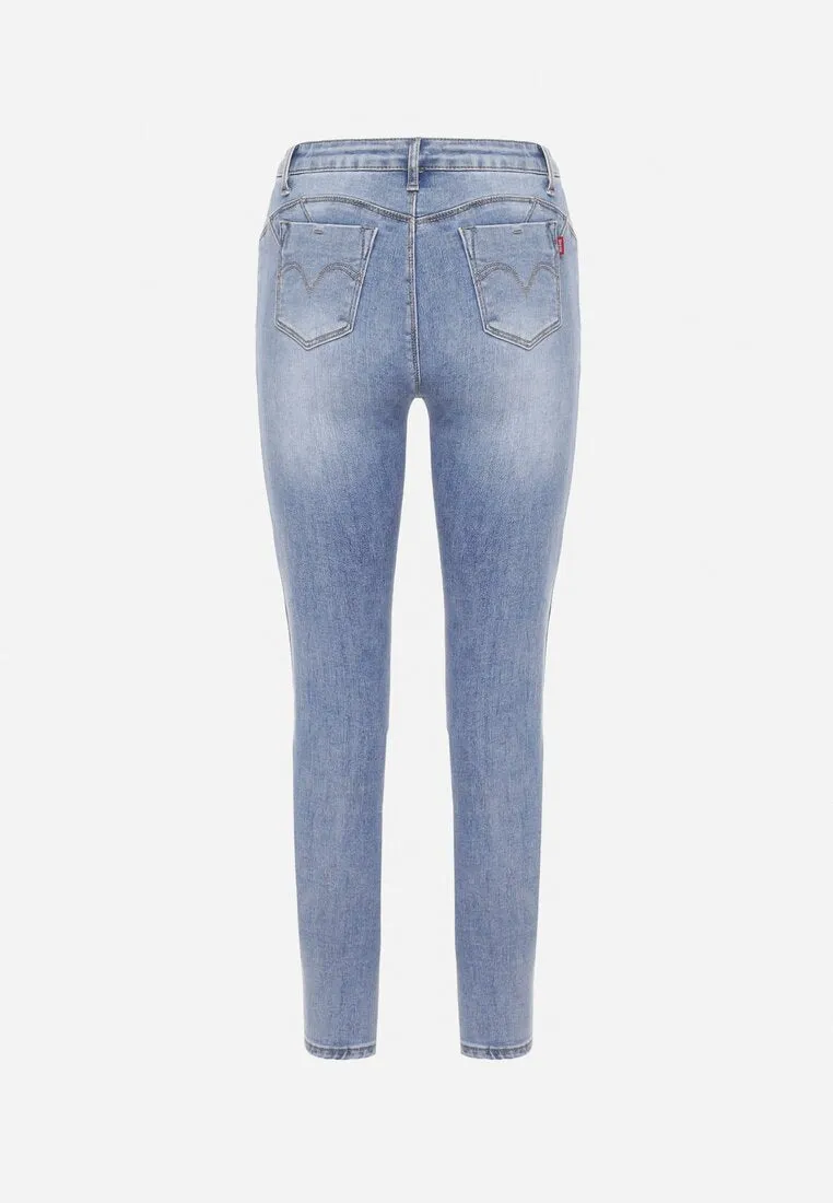 Jean skinny bleu avec trous et effet push up
